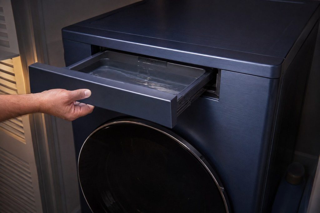 the condensate drawer drawn out of the top of the cabinet